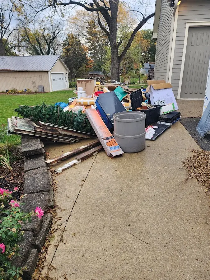 Dumpster being loaded with debris for Demolition Dumpster Rental in Summit